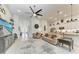 Open concept living room and kitchen with tile flooring and abundant natural light at 5811 Campina Pl, Palmetto, FL 34221