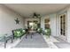 Covered patio with ample seating space, perfect for relaxing outdoors at 5811 Campina Pl, Palmetto, FL 34221
