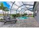 Inviting pool with lounge chairs and a serene lake view at 5811 Campina Pl, Palmetto, FL 34221