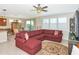 Spacious living area with tile floors, abundant natural light, and comfortable seating at 5952 Snowy Egret Dr, Sarasota, FL 34238