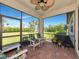 Inviting screened patio with comfortable seating and serene backyard views at 5952 Snowy Egret Dr, Sarasota, FL 34238
