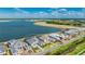 New construction home on the water in a beautiful community with sidewalks and roads at 600 Blue Shell Loop, Sarasota, FL 34240