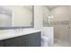 Elegant bathroom featuring a stylish vanity and modern glass enclosed shower at 600 Blue Shell Loop, Sarasota, FL 34240