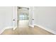 Bright room with french doors opening to an outdoor terrace with water views at 600 Blue Shell Loop, Sarasota, FL 34240