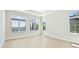 Bright bedroom with large windows showcasing waterfront views at 600 Blue Shell Loop, Sarasota, FL 34240