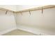 Walk-in closet with wooden shelving at 600 Blue Shell Loop, Sarasota, FL 34240