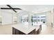 Spacious open kitchen features a large island, modern appliances, and outdoor access at 600 Blue Shell Loop, Sarasota, FL 34240