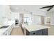 Modern kitchen features a large island, stainless appliances, and abundant cabinet space at 600 Blue Shell Loop, Sarasota, FL 34240
