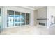 Living room with fireplace and sliding glass doors to backyard at 600 Blue Shell Loop, Sarasota, FL 34240