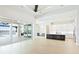 Open floor plan with living room, kitchen, and dining area overlooking the water at 600 Blue Shell Loop, Sarasota, FL 34240