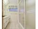Well-lit bathroom with neutral tile, featuring a shower and an extended vanity at 6004 10Th Ave W, Bradenton, FL 34209