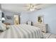 Cozy bedroom with a ceiling fan, and dresser at 6004 10Th Ave W, Bradenton, FL 34209