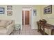 Hallway with neutral paint, tile flooring, and decorative fish at 6004 10Th Ave W, Bradenton, FL 34209