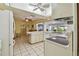 Bright kitchen with skylight, white cabinets, and modern appliances at 6004 10Th Ave W, Bradenton, FL 34209