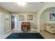 Inviting area showcasing a stylish desk, artwork, and arched doorway connecting to a living room at 6004 10Th Ave W, Bradenton, FL 34209