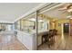 Bright living room with tile flooring and a seamless transition to the kitchen and lanai at 6004 10Th Ave W, Bradenton, FL 34209