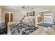 Open living space with tile floors, comfortable sofa, and access to the sunroom at 6004 10Th Ave W, Bradenton, FL 34209