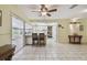 Open-concept living area with tile flooring and seamless flow to the kitchen and lanai at 6004 10Th Ave W, Bradenton, FL 34209