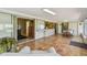 View from sunroom into other rooms in the home and backyard with tiled floor at 6004 10Th Ave W, Bradenton, FL 34209