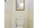 Bathroom featuring a standard toilet with storage or shelving near by at 6004 10Th Ave W, Bradenton, FL 34209