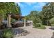 Beautiful backyard featuring an outdoor kitchen, living area, and meticulous landscaping at 6015 S Elkins Ave, Tampa, FL 33611