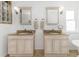 Charming bathroom with double vanities, granite countertops, and decorative mirrors at 6015 S Elkins Ave, Tampa, FL 33611