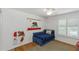 bedroom with flag banner, hardwood flooring and plantation shutters at 6015 S Elkins Ave, Tampa, FL 33611