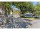 View of the house and long driveway with pavers and a stone mailbox on a sunny day at 6015 S Elkins Ave, Tampa, FL 33611
