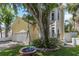 View of the house with a tree and swing set in the front yard at 6015 S Elkins Ave, Tampa, FL 33611