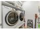 Well-organized laundry room featuring a modern washer and dryer at 6015 S Elkins Ave, Tampa, FL 33611
