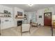 Bright living room featuring a fireplace, built-in shelves, and modern decor at 6015 S Elkins Ave, Tampa, FL 33611