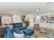 Open-concept living area showcasing stylish furnishings, a colorful rug, and ample seating at 6015 S Elkins Ave, Tampa, FL 33611