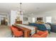 Open-concept living and dining area with modern furnishings and stylish decor at 6015 S Elkins Ave, Tampa, FL 33611