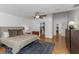 Spacious main bedroom with wood floors, a ceiling fan, and a walk-in closet at 6015 S Elkins Ave, Tampa, FL 33611