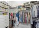 Well-organized walk-in closet with ample hanging space, shelves, and drawers for storage at 6015 S Elkins Ave, Tampa, FL 33611