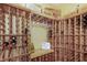 Wine cellar featuring custom-built wooden racks, ample storage, and a unique design at 6015 S Elkins Ave, Tampa, FL 33611