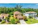 Aerial view of a well-maintained two-story home with lush landscaping at 6111 Horse Mill Pl, Palmetto, FL 34221