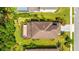 An aerial view showcases the home's roof, landscaping, and surrounding yard at 6111 Horse Mill Pl, Palmetto, FL 34221