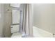 Bright bathroom featuring a shower and bathtub with sleek fixtures and tiled walls at 6111 Horse Mill Pl, Palmetto, FL 34221