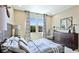 Comfortable bedroom showcasing a statement mirror and aviation decor at 6111 Horse Mill Pl, Palmetto, FL 34221