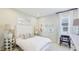 Brightly lit bedroom with modern decor, carpet floors, and a large window at 6111 Horse Mill Pl, Palmetto, FL 34221