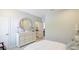 Bright bedroom with carpet, dresser, stylish decor, and ensuite access at 6111 Horse Mill Pl, Palmetto, FL 34221