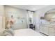 Well-lit bedroom featuring tasteful decor, soft carpet, and a light color scheme at 6111 Horse Mill Pl, Palmetto, FL 34221