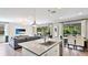 Spacious kitchen with a central island, stainless steel appliances, and an open layout connecting to the living area at 6111 Horse Mill Pl, Palmetto, FL 34221