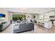 Bright, open concept living room with a kitchen, dining and deck access at 6111 Horse Mill Pl, Palmetto, FL 34221