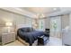 Beautiful main bedroom featuring an elegant chandelier and decorative wall panels at 6111 Horse Mill Pl, Palmetto, FL 34221