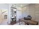 Home office with large desk, built-in shelving, and modern decor at 6111 Horse Mill Pl, Palmetto, FL 34221
