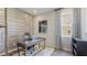 Home office featuring a large desk, stylish decor, and a light color scheme at 6111 Horse Mill Pl, Palmetto, FL 34221