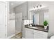 Modern bathroom featuring a spacious vanity, walk-in shower, and contemporary design at 6317 Rivo Lakes Blvd, Sarasota, FL 34241