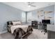 Bedroom showcasing a well-lit desk and a comfortable bed, perfect for study and relaxation at 6317 Rivo Lakes Blvd, Sarasota, FL 34241